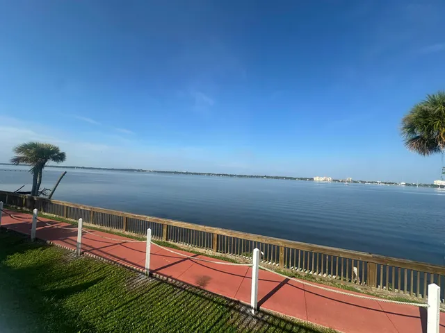 a view of a balcony with an ocean