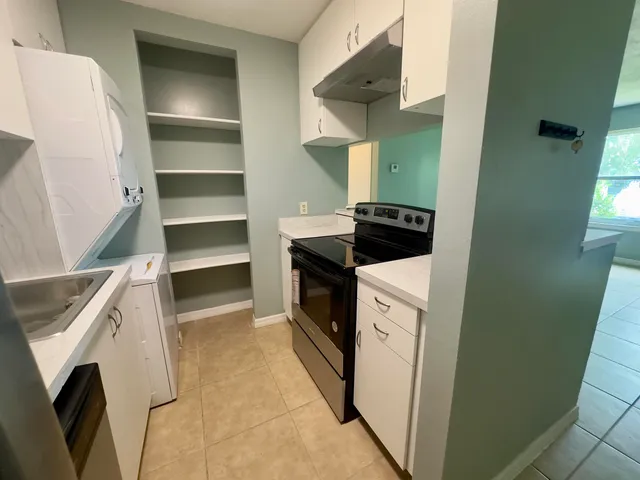 a kitchen with a stove and a refrigerator