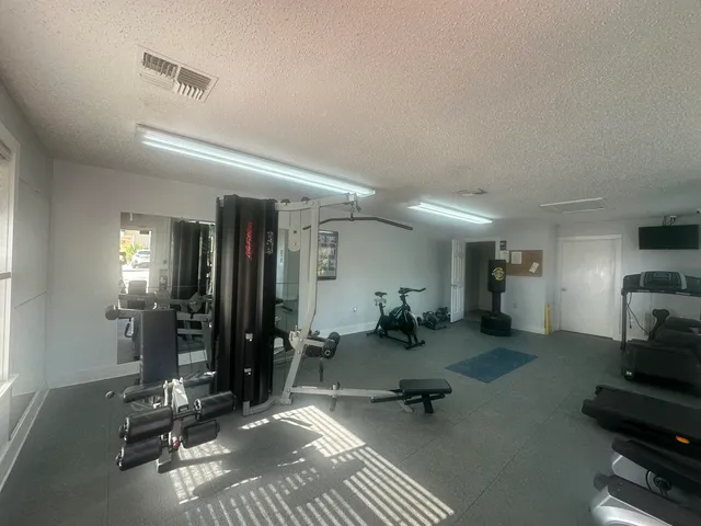 a room with lots of chairs and gym equipment