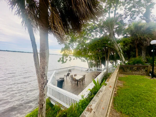 a view of a balcony with yard