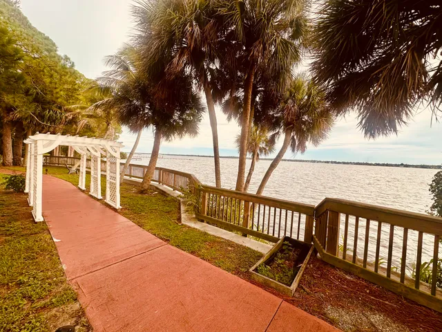 a view of a balcony with trees