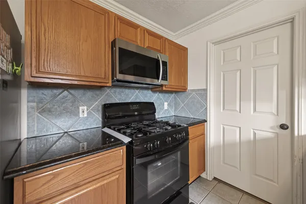 a kitchen with kitchen island granite countertop a sink and counter space