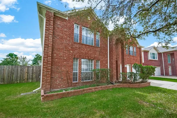 a brick building with a yard