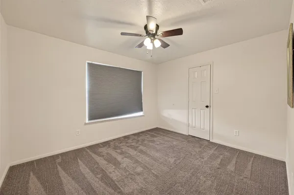 a view of a big room with carpet