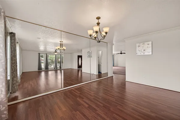 a view of a livingroom with wooden floor