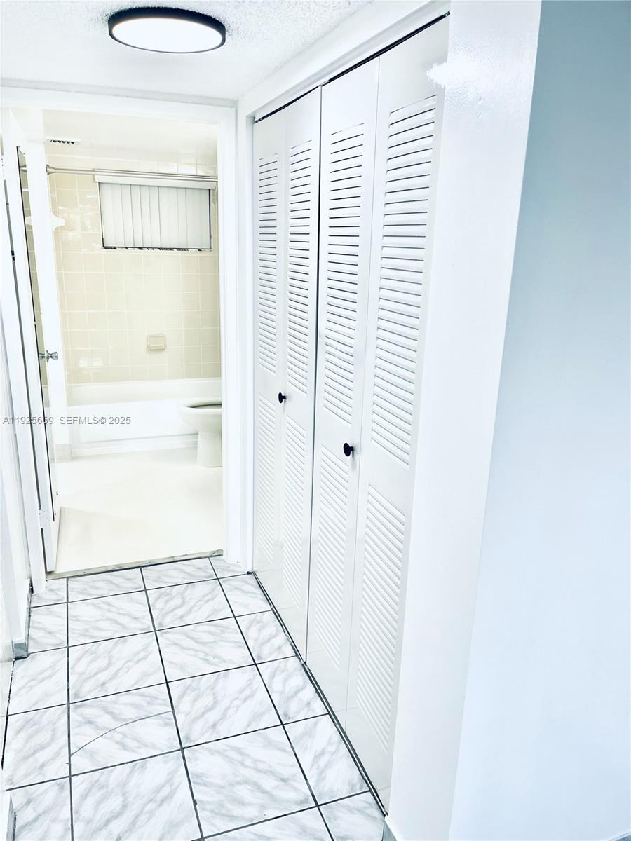 6801 Harding Avenue, Unit 306 Miami Beach, FL 33141 - Photo 25 of 30 a view of a hallway