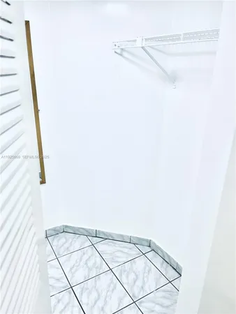 a view of empty room with windows