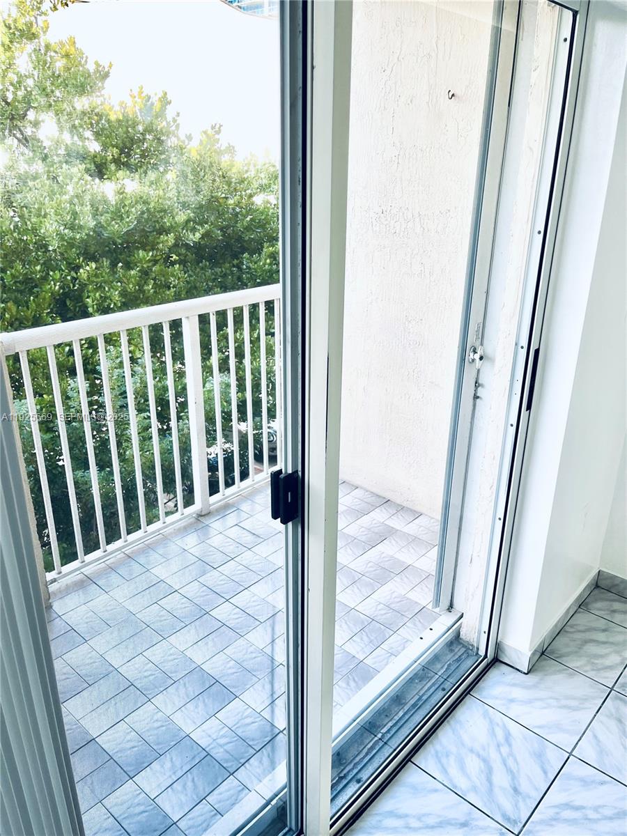 6801 Harding Avenue, Unit 306 Miami Beach, FL 33141 - Photo 30 of 30 a view of a balcony with a porch