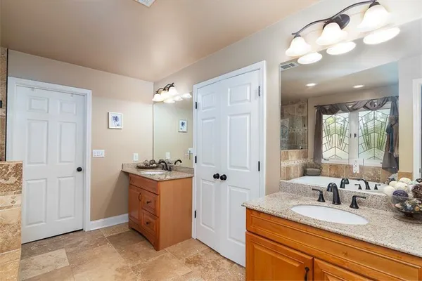 a bathroom with a bathtub and window