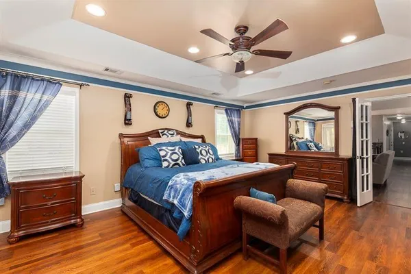 a view of a hallway with wooden floor