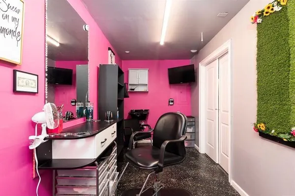 an aerial view of a house with garden space and street view