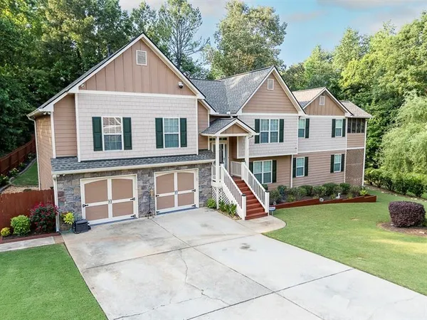 an aerial view of a house with outdoor space