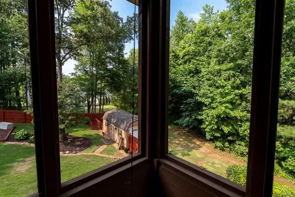 a view of a house with a yard and plants