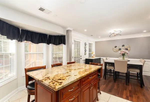 a kitchen with a table and a fireplace