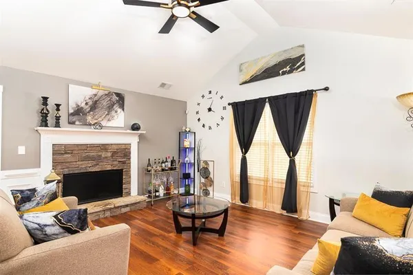 a bedroom with a bed couch and window