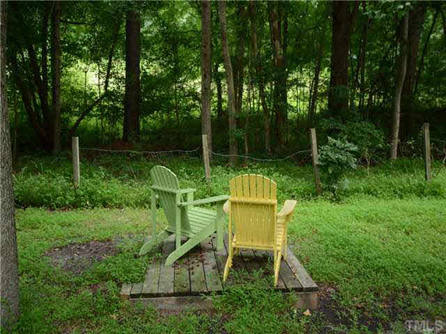 1328 Princess Anne Road Cary, NC 27513 - Photo 2 of 20 a view of a chair and table in the garden