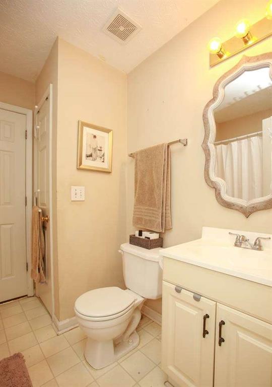177 Rustin Drive Dallas, GA 30157 - Photo 15 of 26 a bathroom with a sink a toilet and a mirror