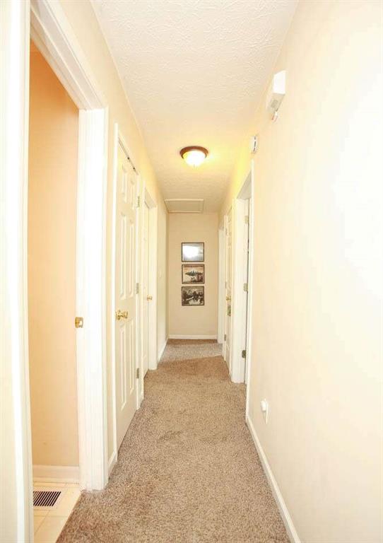 177 Rustin Drive Dallas, GA 30157 - Photo 18 of 26 a view of a hallway with wooden shelves