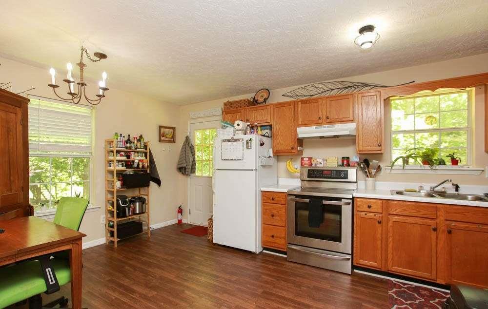 177 Rustin Drive Dallas, GA 30157 - Photo 7 of 26 a kitchen with stainless steel appliances a stove top oven and a refrigerator