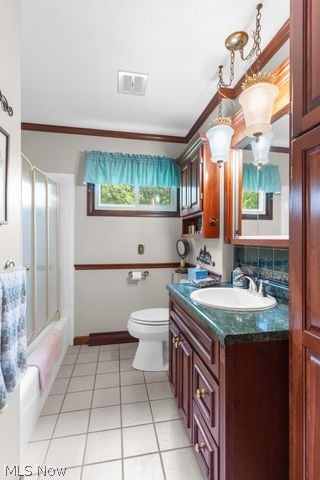 815 North Road Niles, OH 44446 - Photo 23 of 27 Full bathroom with vanity, tile patterned floors, ornamental molding, shower / washtub combination, and toilet