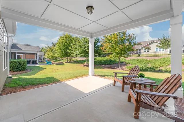 a view of swimming pool and outdoor seating