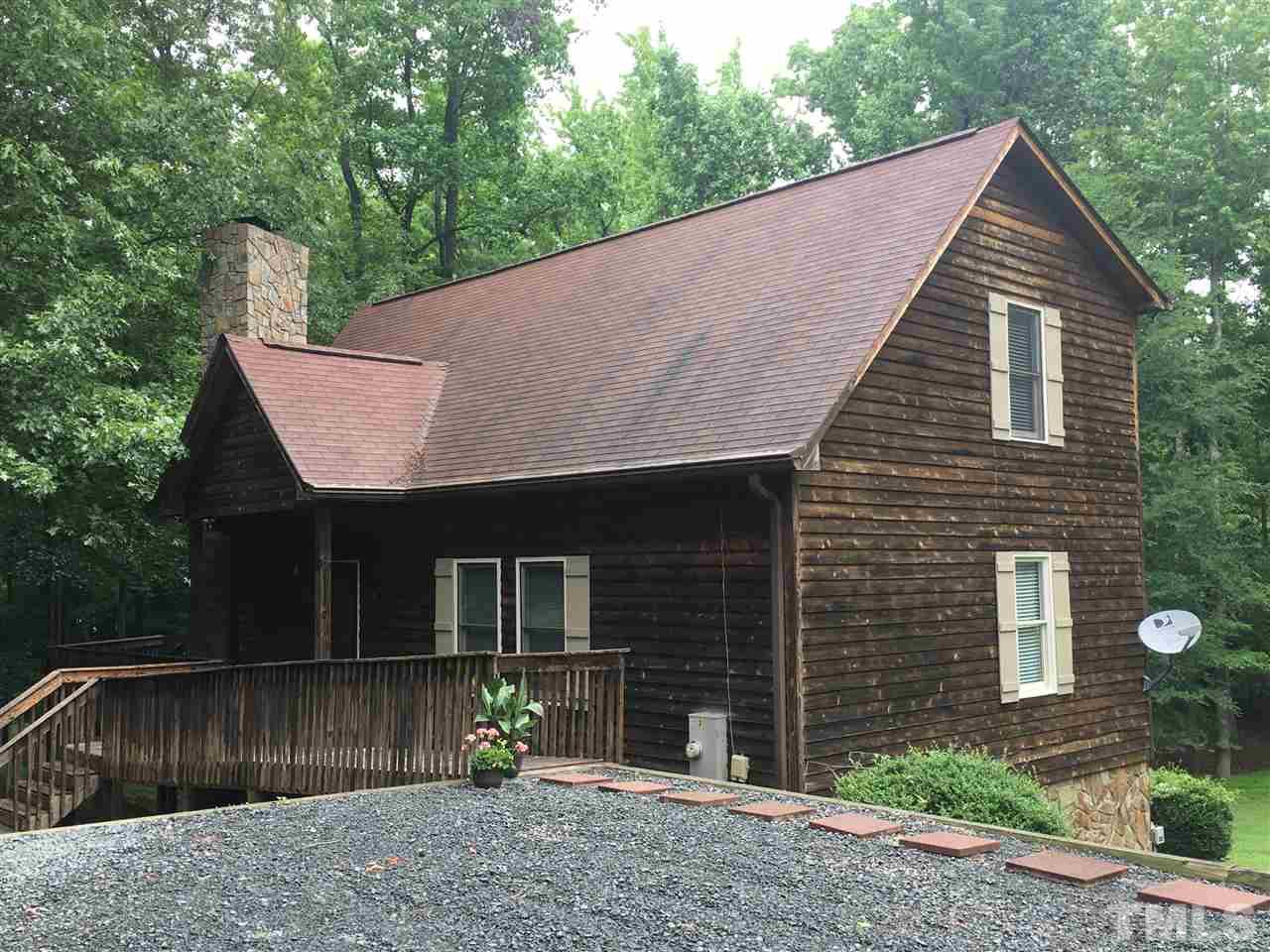 4791 Thomas Road Henderson, NC 27537 - Photo 1 of 25 a view of a house with a yard and large tree