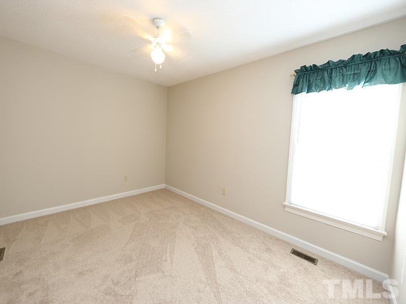 4791 Thomas Road Henderson, NC 27537 - Photo 15 of 25 an empty room with a window