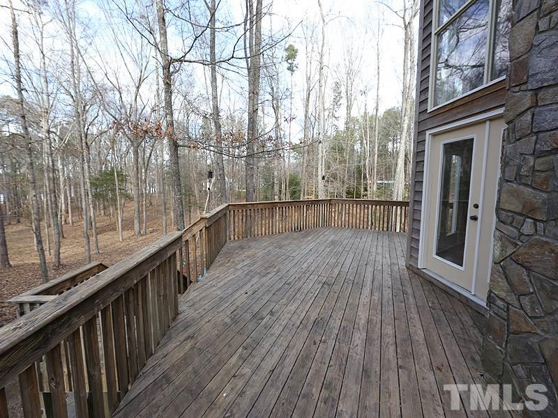4791 Thomas Road Henderson, NC 27537 - Photo 24 of 25 a view of a balcony with wooden floor and fence
