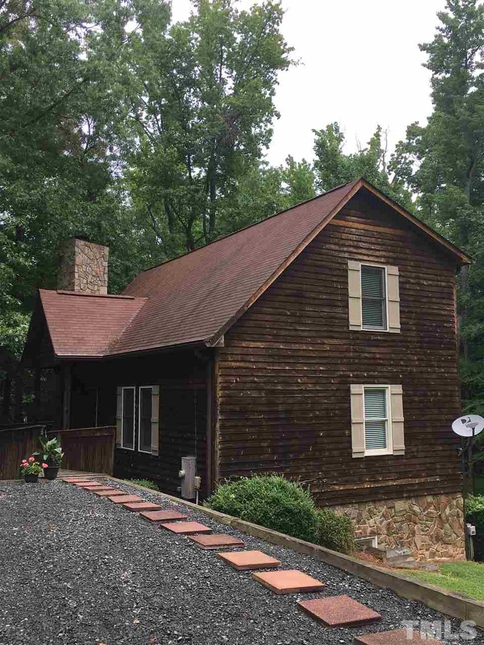 4791 Thomas Road Henderson, NC 27537 - Photo 4 of 25 a front view of a house with a yard