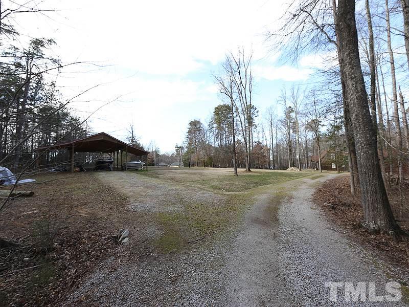 4791 Thomas Road Henderson, NC 27537 - Photo 7 of 25 a view of a field with trees in the background