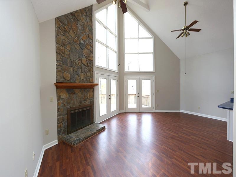 4791 Thomas Road Henderson, NC 27537 - Photo 8 of 25 wooden floor fireplace and windows in an empty room