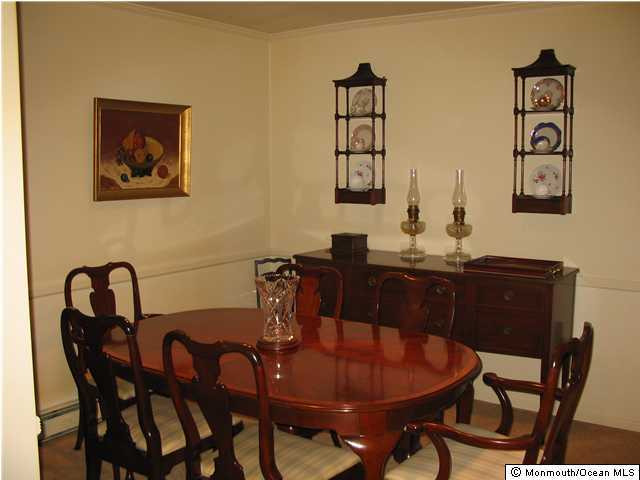 65 East River Road, Unit 6 Rumson, NJ 07760 - Photo 3 of 3 a dining room with furniture and window