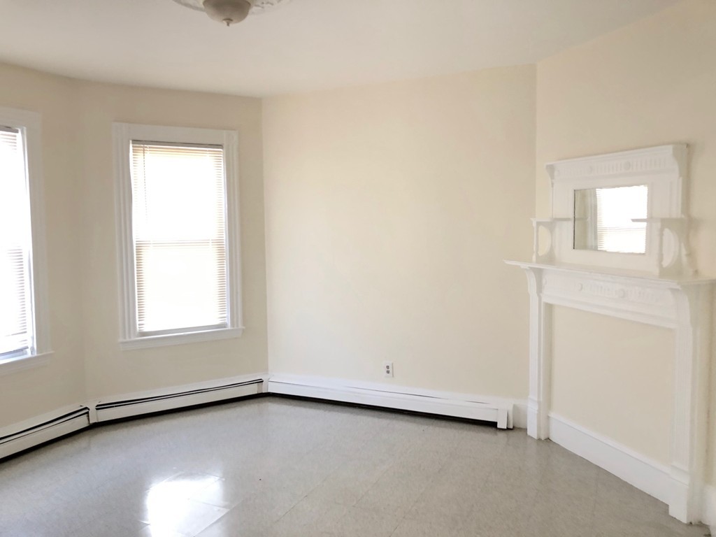 10 Buckley Avenue, Unit 1 Boston, MA 02130 - Photo 2 of 15 an empty room with a window