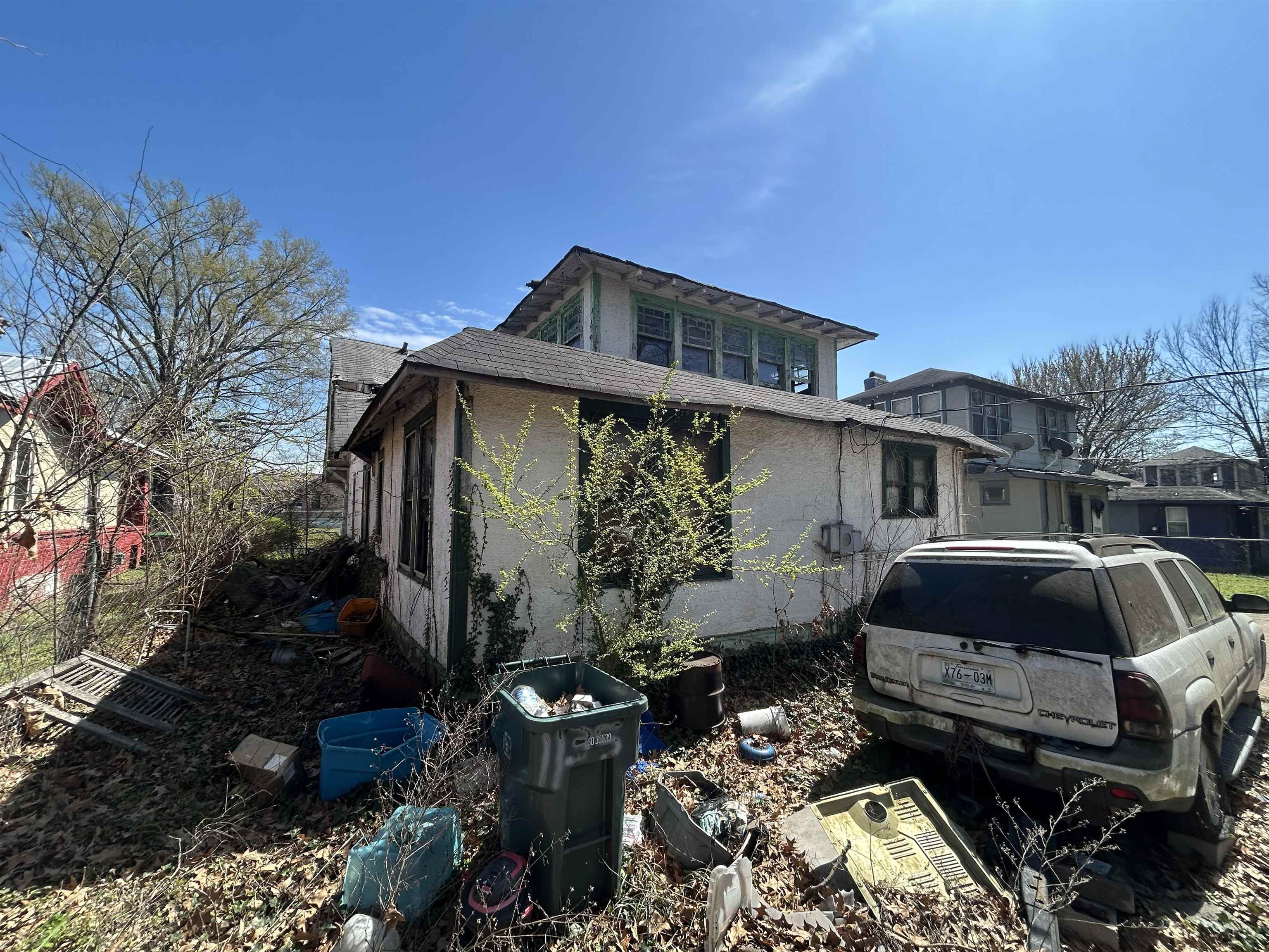 1135 Rayner Street Memphis, TN 38106 - Photo 5 of 6 View of home's exterior featuring stucco siding and roof with shingles