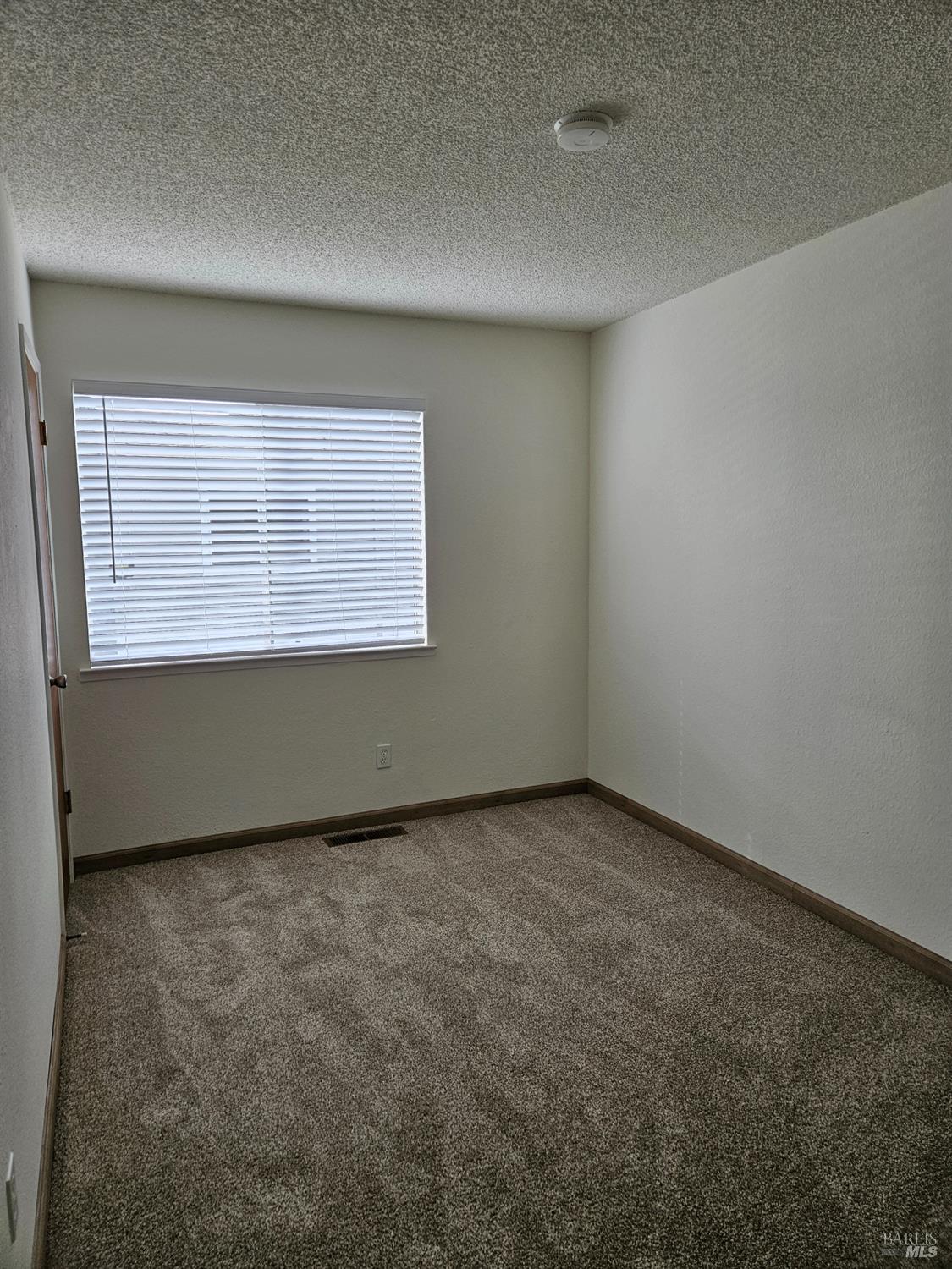 1930 Grande Circle, Unit 72 Fairfield, CA 94533 - Photo 28 of 34 an empty room with a window