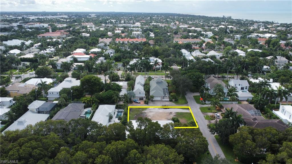 76 4th Street North Naples, FL 34102 - Photo 4 of 7 an aerial view of residential houses with outdoor space and trees