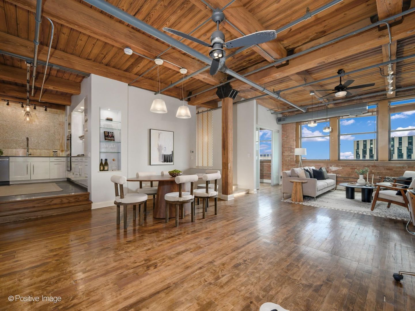 411 South Sangamon Street, Unit 7D Chicago, IL 60607 - Photo 3 of 20 a living room with lots of furniture and a wooden floor
