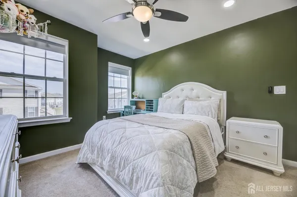 a bed room with a bed and a window