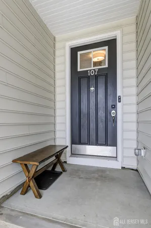 a wooden bench sitting in front of a building