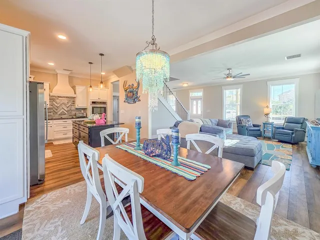 a kitchen with kitchen island granite countertop a cabinets and a sink