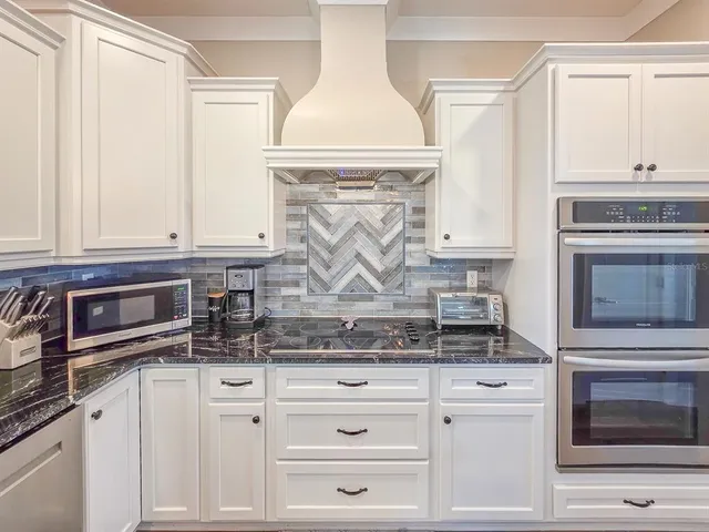 a view of staircase with wooden floor and chair