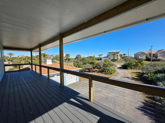 an aerial view of a house with swimming pool and outdoor space