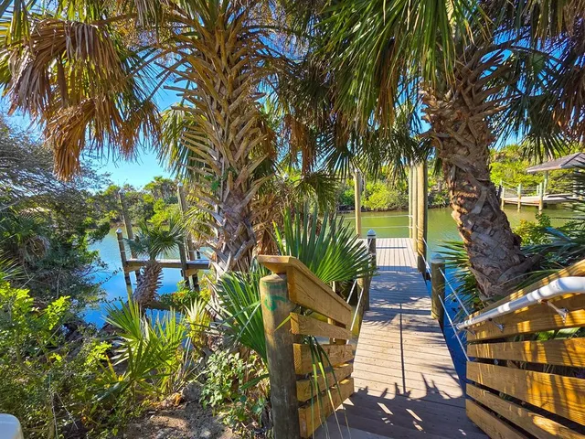 an aerial view of residential building and ocean