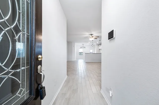 a view of a kitchen from the hallway