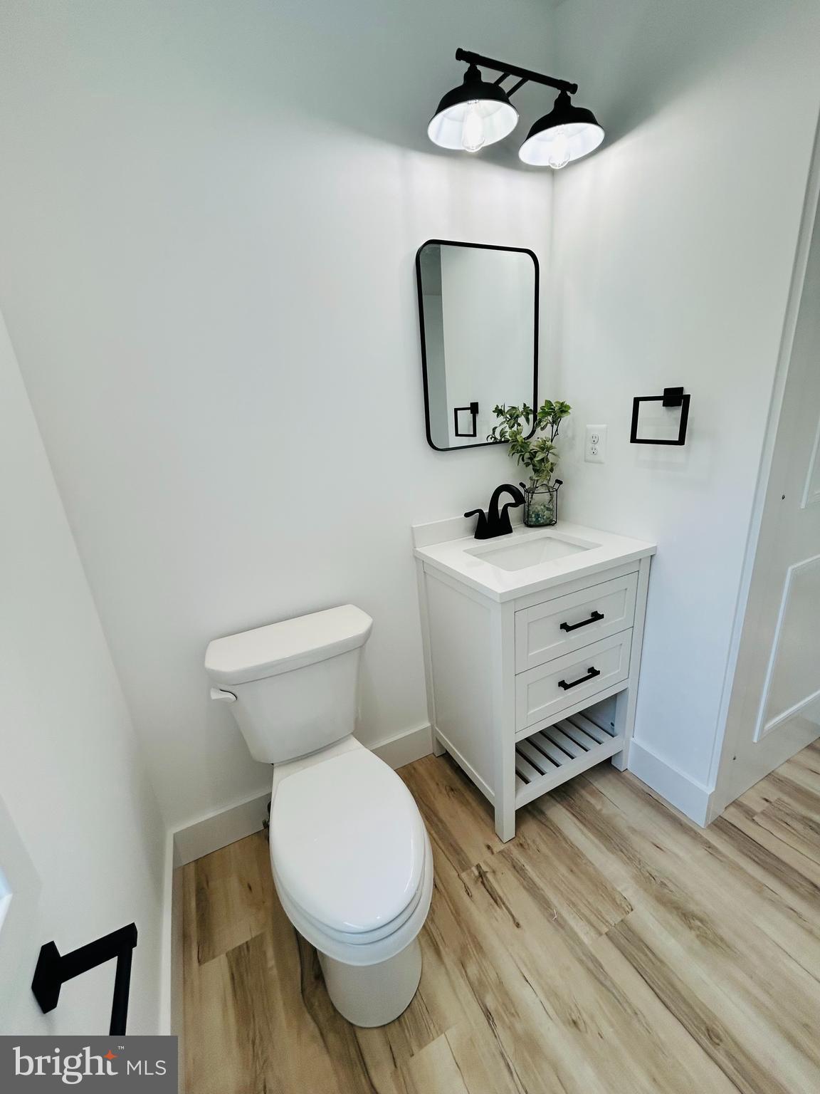 296 Post Road Rising Sun, MD 21911 - Photo 5 of 12 a bathroom with a toilet sink and mirror