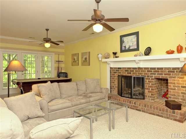 2520 Beechridge Road Raleigh, NC 27608 - Photo 16 of 25 Lower level family room has a wood burning fireplace.