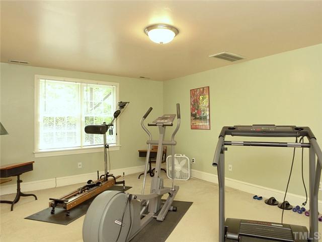 2520 Beechridge Road Raleigh, NC 27608 - Photo 18 of 25 On the lower level, this bedroom is used as an exercise room and has an adjoining bath and closet.