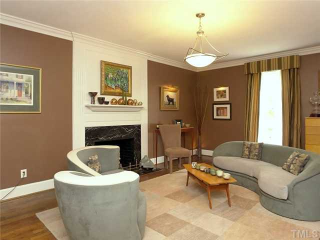 2520 Beechridge Road Raleigh, NC 27608 - Photo 4 of 25 Stunning fireplace in the great room is accented with marble surround and has gas logs.