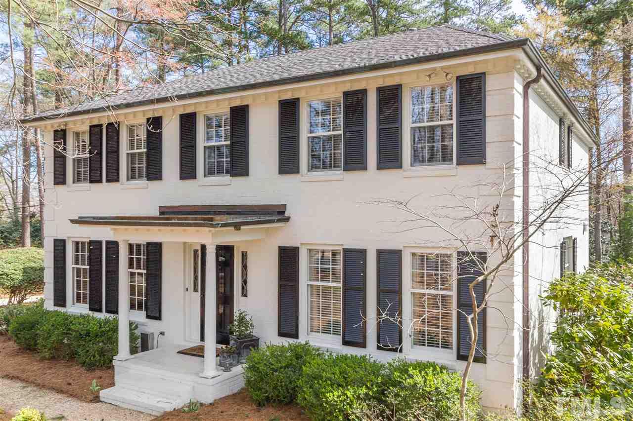 2408 Ridge Road Raleigh, NC 27612 - Photo 1 of 25 a view of a brick house with large windows and large windows