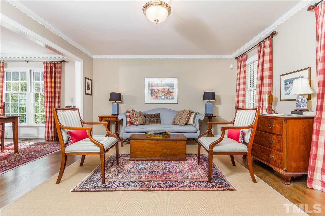 2408 Ridge Road Raleigh, NC 27612 - Photo 13 of 25 a living room with furniture a rug and a large window